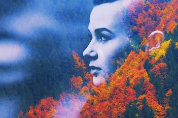  Double multiply exposure abstract dark portrait of dreamy cute young woman face head silhouette in autumn colors forest trees nature. Psychology power of mind, human spirit, mental health, zen concept