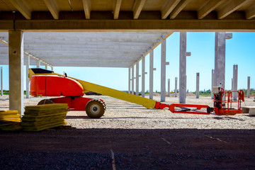 Cherry picker is parked at building site