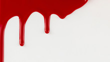 Red Paint Dripping On White Background