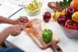 © Watcharin - In selective focus of carrot was cutting by knife, preparing for salad meal by beauty woman,healthy food,good for life,blurry light around