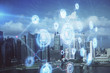 © peshkova - Data theme hologram drawing on city view with skyscrapers background multi exposure. Bigdata concept.