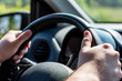 © PT pictures - man drive car with hands on the steering wheel