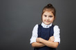 © elena_fedorina - Portrait of a little girl in the school uniform going to school. Copy space. The concept of education, back to school, etc.