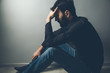 © ARAMYAN - sad man hand in head sitting ground