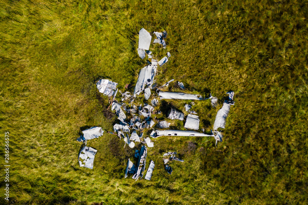 Top-down aerial view of an old aircraft crash site (Vampire Jet) in the ...