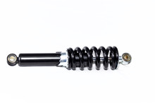A Brand New Clean Black And Silver Motorcycle Shock Absorber Over White, This Shock Is Also Used On ATVs.