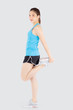 © NT_studio - Beautiful young asian woman in sport standing stretch muscle leg exercise with healthy isolated on white background, asia girl shape fit warm up and workout training for healthy, wellness concept.