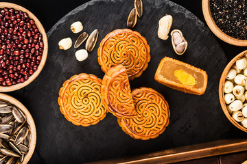 Poster - Traditional mooncakes on table setting with teacup.