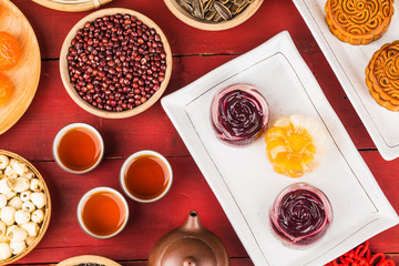 Poster - Traditional mooncakes on table setting with teacup.