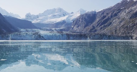 Wall Mural - Alaska Glacier Bay Johns Hopkins glacier front with blue water and reflection copyspace. Cruise travel vacation in Alaska, USA. Shot on RED cinema camera.