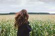 © Galina Zhigalova - Beautiful carefree long hair asian girl in knitted sweater from behind in the autumn corn field. Sensitivity to nature concept