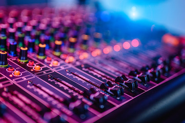 Professional audio mixing console in concert.