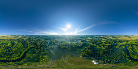 Wall Mural - 360-degree panoramic aerial view of the field, forest and river covered with a thick layer of morning fog