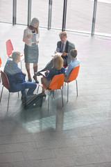 Wall Mural - High angle view of colleagues planning while sitting during meeting at office