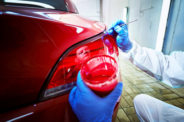 Wall Mural - Tinting defects of a red car paint on the service