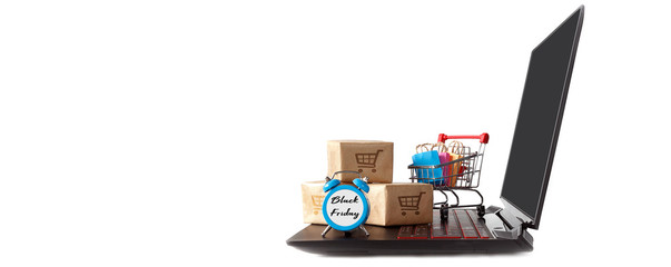 Online shopping / ecommerce and delivery service concept : Paper cartons with a shopping cart or trolley logo on a laptop keyboard, depicts customers order things from retailer sites via the internet.