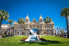 Photo taken from front to Casino Monte Carlo. Several tourists and a beautiful blue sky day. Automobile event day and preparation for the 2016 Monaco Grand Prix.