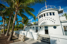 Palm Trees Cast Shadows On The Beach Patrol Headquarters, An Art Deco Building With A Nautical Theme Opened In 1934 In South Beach, Miami, Florida, USA