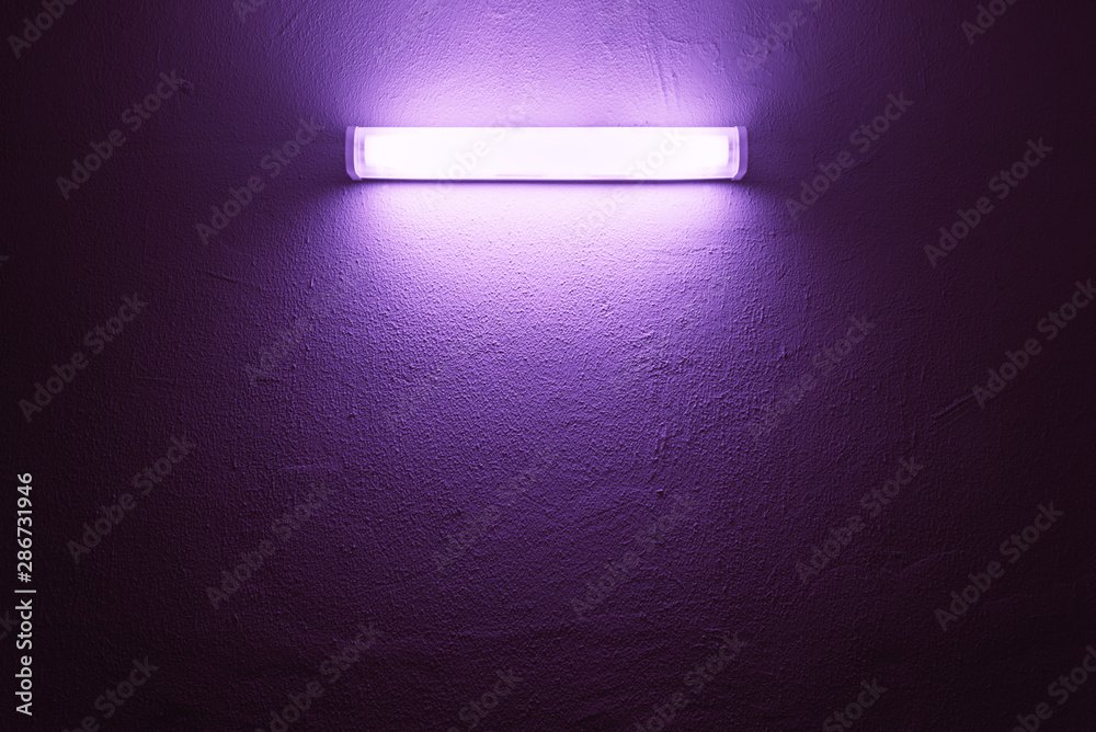 UV lamp on a rough wall. - obrazy, fototapety, plakaty 