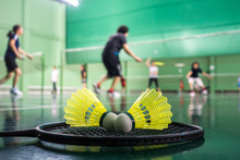Badminton Courts With Players Competing