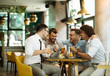 © bugarskipavle3 - Friends are happy while watching game at te ub and drinking beer.