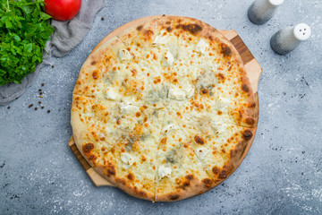 Pizza Quattro formaggi on beautiful grey table