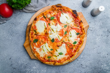 Sticker - Italian pizza Margherita buffalo with tomatoes, mozzarella and basil on beautiful grey table