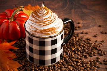 Wall Mural - A Pumpkin Spice Latte on a Rustic Wooden Table