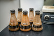 Dirty Erlenmeyer Flasks with Dark Soil Texture Samples