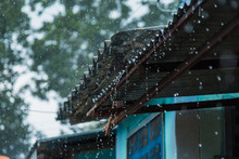 Rain Storm With Metal Sheet Roof,rainwater Flows Down The Roof.