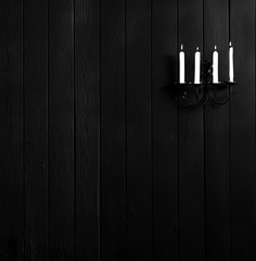 Canvas Print - candlestick with candles on a black wall