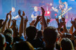 © Anton Gvozdikov - Fans cheering musicians on stage at live rock music concert