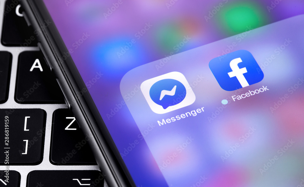 New icon Facebook app on the display smartphone. Facebook is largest ...