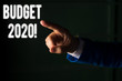 Word writing text Budget 2020. Business photo showcasing estimate of income and expenditure for next or current year Isolated hand pointing with finger. Business concept pointing finger
