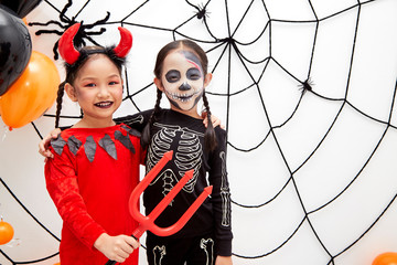 Wall Mural - Asian child girls in halloween costumes