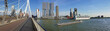© psychoshadow - Cityscape panorama from Erasmus bridge over Meuse river in Rotterdam, the Netherlands. Tall modern buildings on the horizon and big ships crossing the Erasmusbrug canal.