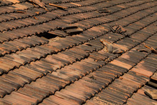Broken Old Terracotta Rooftiles With Hole, Traditional Cover In India, GOA. Close Up. Textured Summer Background.