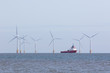 Offshore wind farm turbines with maintenance supply vessel ship
