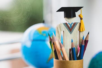 Wall Mural - graduate or education knowledge learning study abroad concept : graduation cap with blur america ear