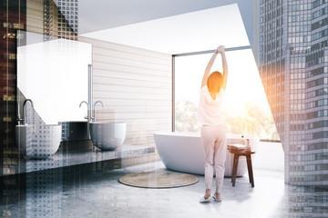 Woman in wooden bathroom corner