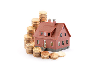 Poster - Invest in real estate concept. Small brown toy house with golden coins