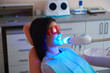 © Yakobchuk Olena - Happy lady wearing protective glasses in dentistry