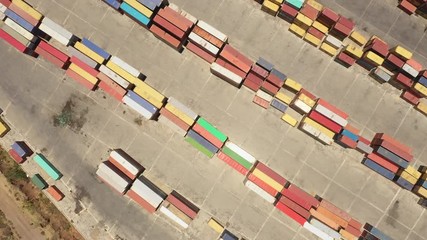 overhead drone shot of containers at dry port of mojo in ethiopia, connected by railway line to djib
