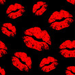 Vector red seamless pattern on black background. Lips prints