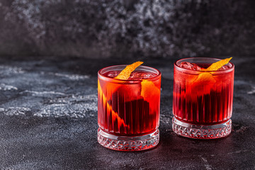 Wall Mural - Negroni cocktail with orange peel and ice.