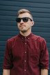 © Creator - Fashion portrait of a handsome young man with sunglasses in a stylish shirt