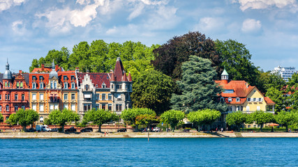 Wall Mural - Constance or Konstanz in summer, Germany. Scenic view of coast of Constance Lake (Bodensee). Panorama of embankment in central Constance with beautiful vintage houses. Scenery of old European town.