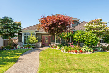 A perfect neighbourhood. Houses in suburb at Summer in the north America. Luxury houses with nice landscape.