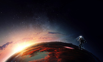 Wall Mural - spaceman and planet, human in space concept