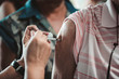 © kuarmungadd - The patient is vaccinated in the arm to prevent influenza: the concept of disease prevention
